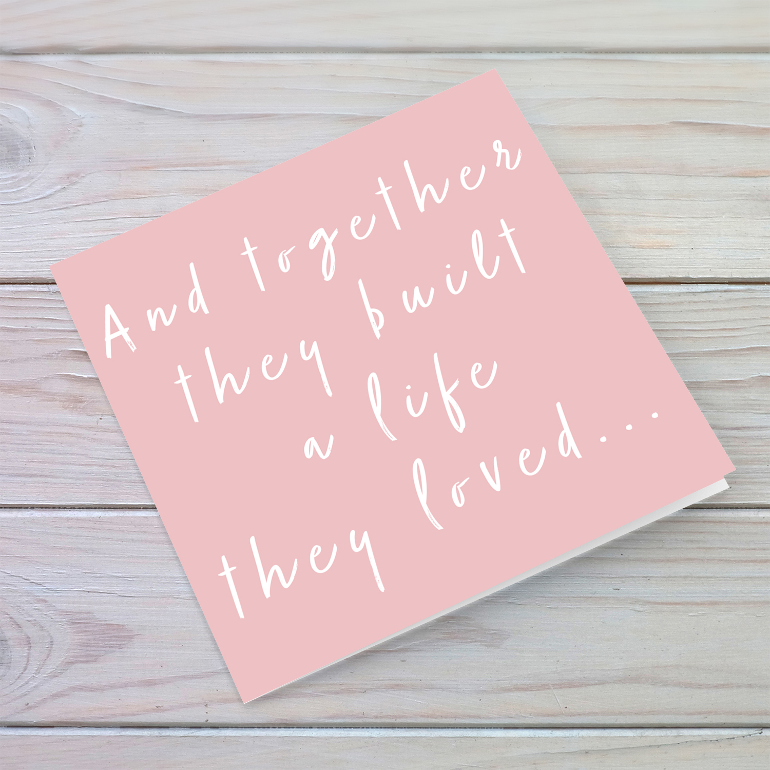 Pink background with white text, and together they built a life they loved in English