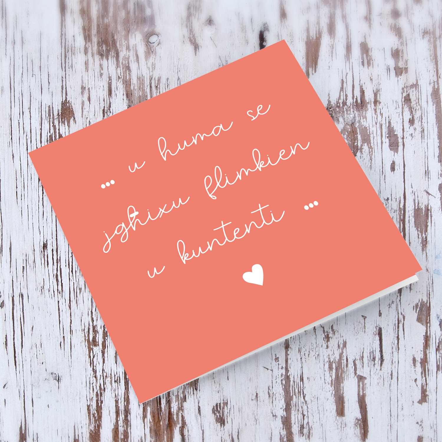 Red coloured background wedding card in maltse with white heart