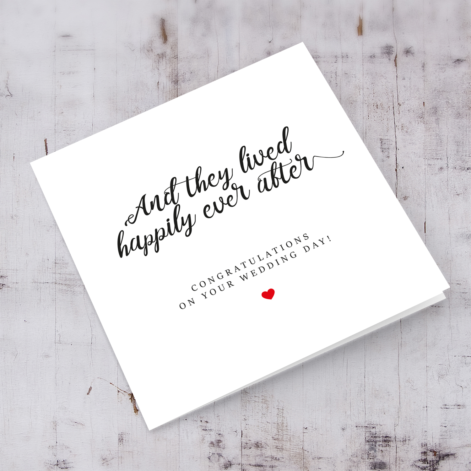 Minimalist wedding card with small red heart in English