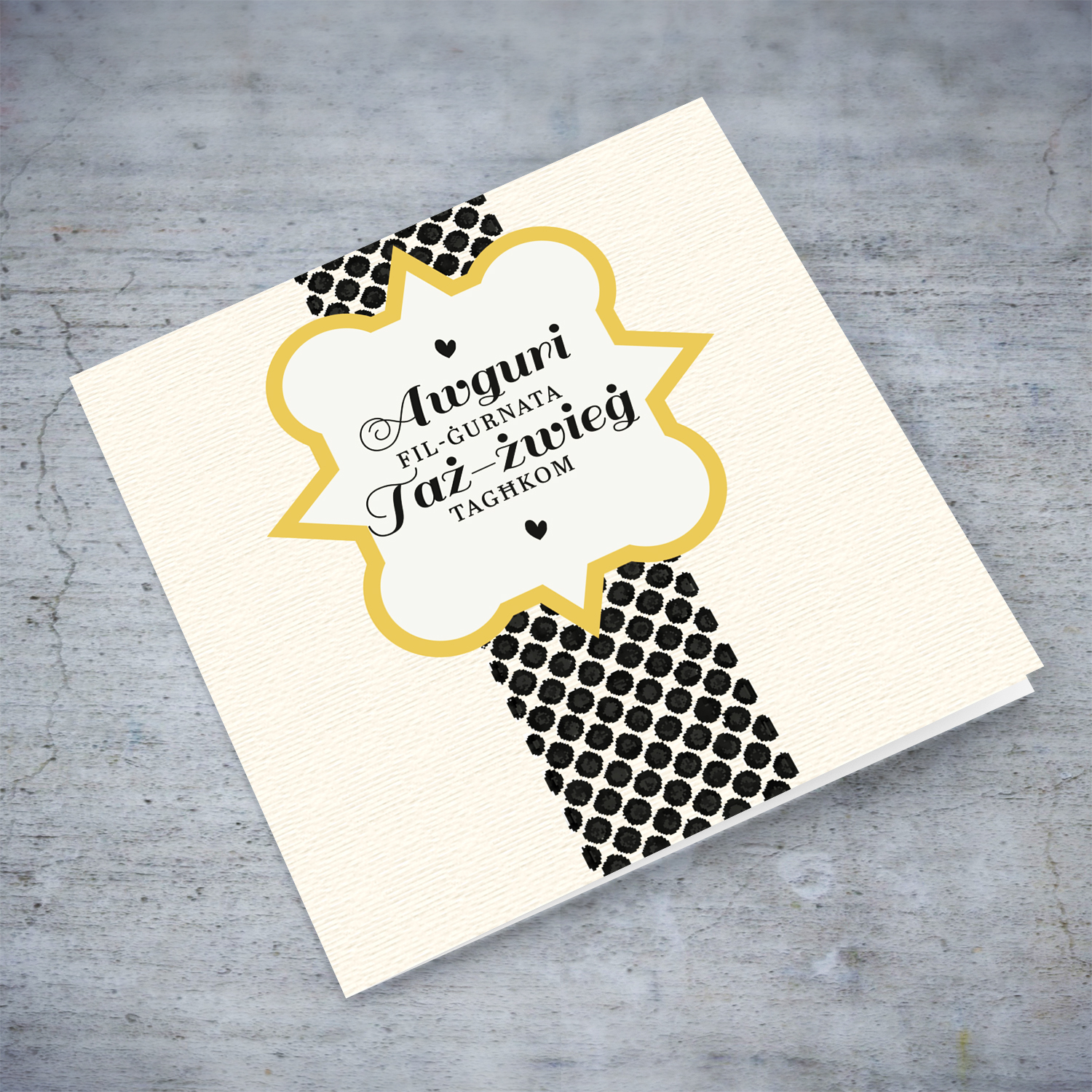 Textured printed background with dotted rectangle wedding card in Maltese