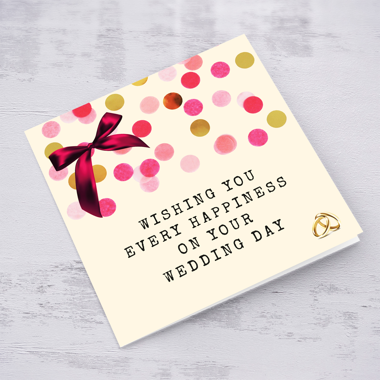 Cute wedding card with pink bow and scattered colourful confetti in English