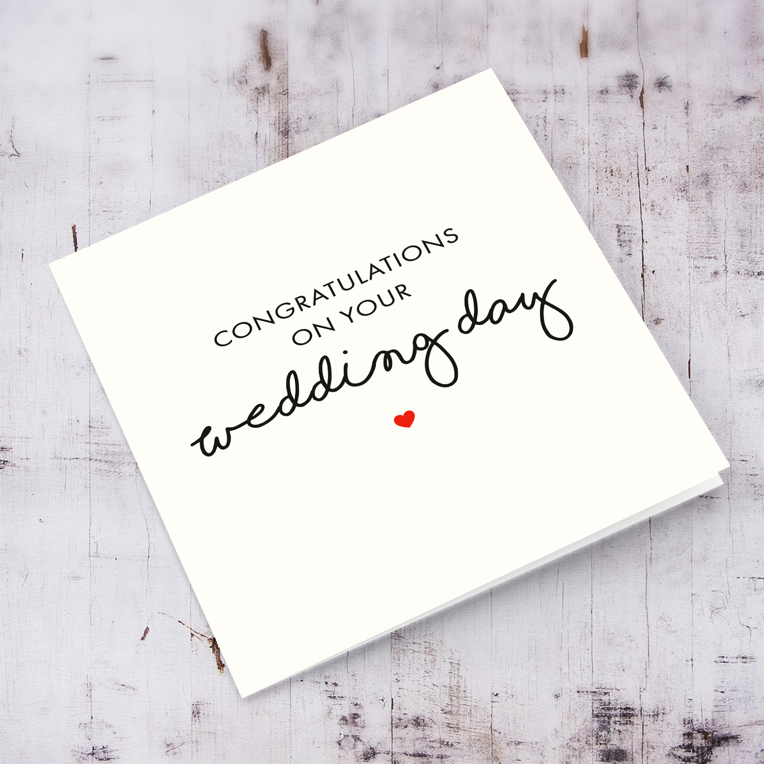 Minimalist wedding card in black text and red heart in English