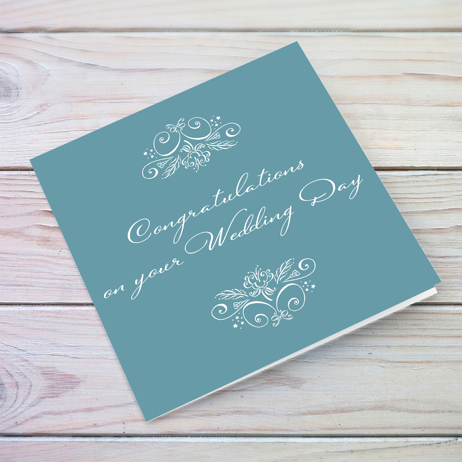 Elegant monochrome wedding card in a shade of blue background and white text in English (blank message inside)