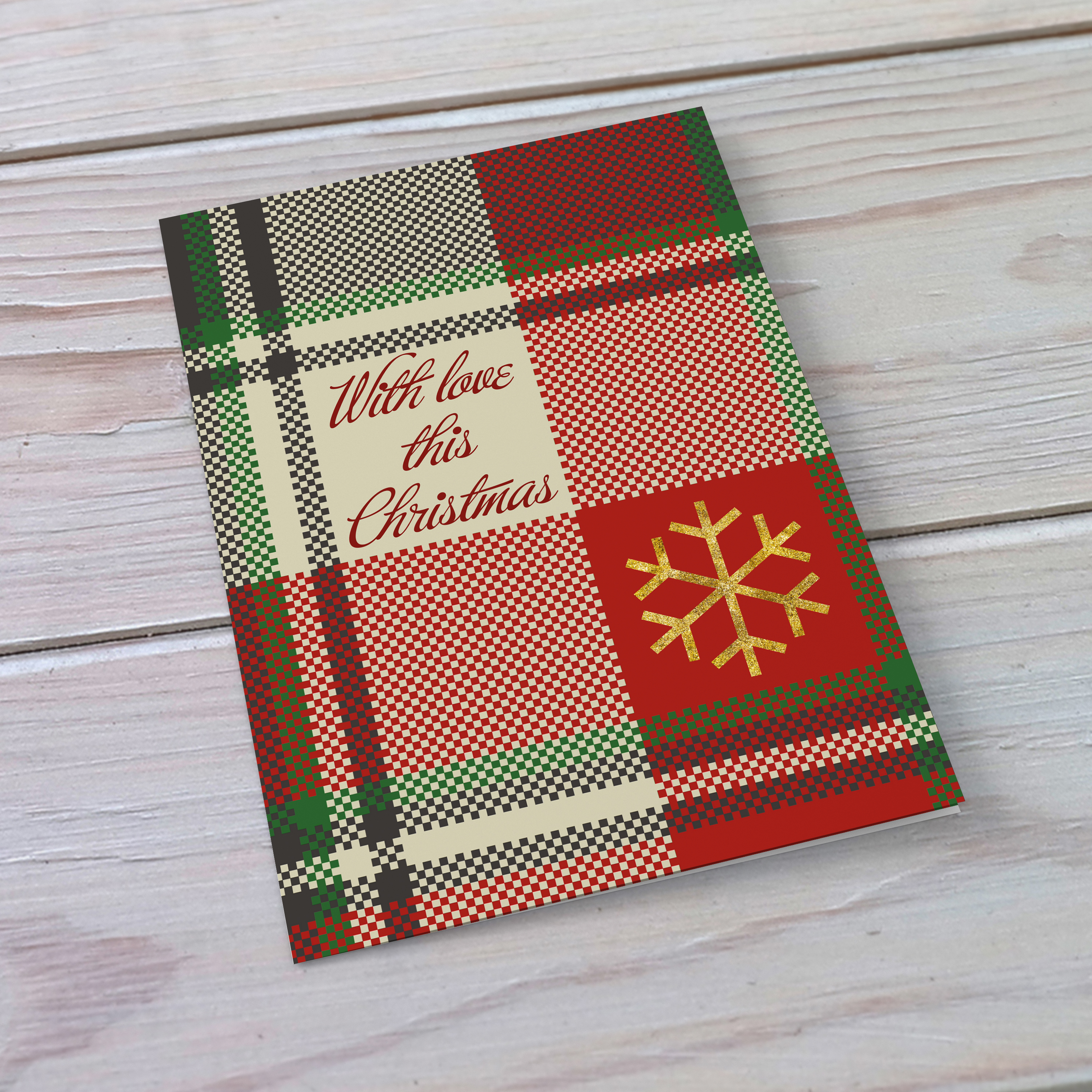 A beautiful A5 Christmas card in a tartan print, featuring a golden snowflake in English
