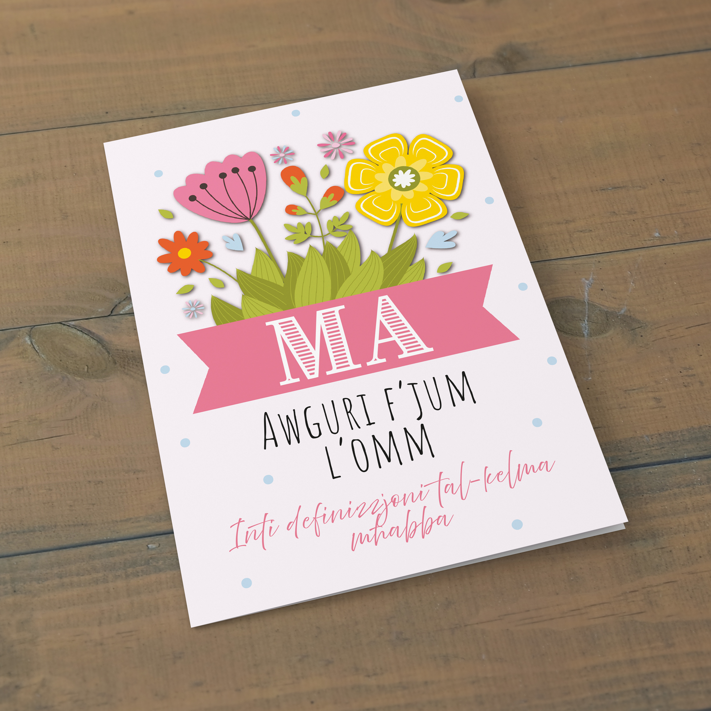 Cute Mother's Day card in a light pink background featuring colourful florals and a special message in Maltese